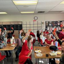 Room full of staff, showing their lunar new year gifts