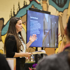 District Principal, Allison Gardner opens the luncheon by reading the land acknowledgement.